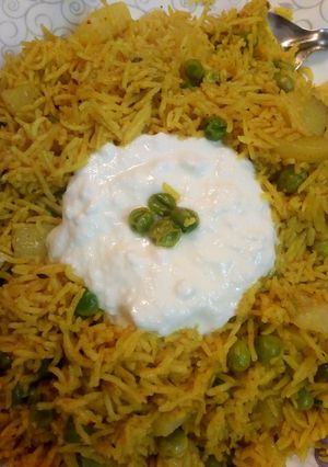 A picture of Tawa pulav with curd.