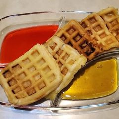 A picture of Waffle with Strawberry & Maple Syrup.