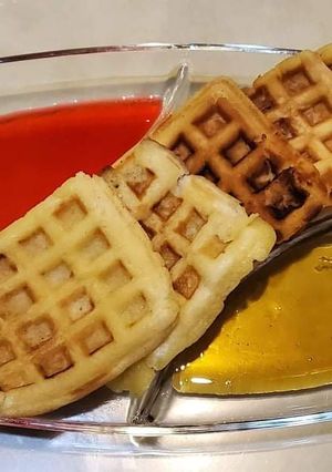 A picture of Waffle with Strawberry & Maple Syrup.