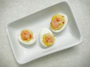 A picture of deviled eggs with shrimp