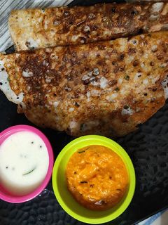 A picture of Rava dosa with chutney.