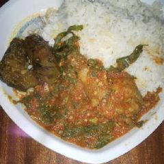 A picture of Rice with vegetable sauce.