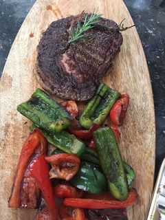 A picture of Beef steak with bell peppers.