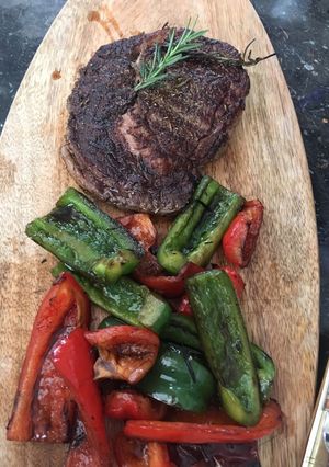 A picture of Beef steak with bell peppers.