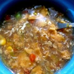 A picture of Mix veggies and chicken soup.