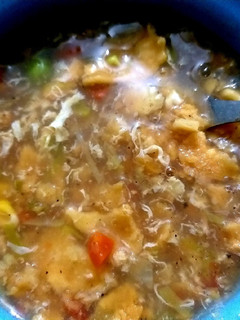 A picture of Mix veggies and chicken soup.