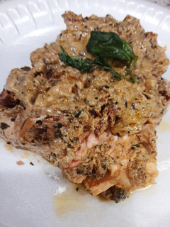 A picture of Pan fried Salmon with creamy sun-dried tomato sauce.