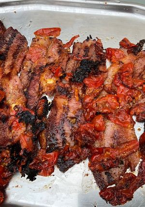 A picture of Grilled Marinated Pork Belly with Cherry Tomatoes.