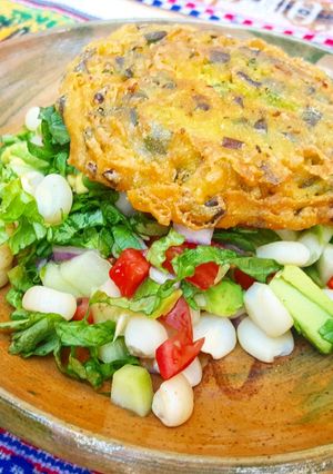 A picture of Noodle Fritter with Mixed Corn Salad.