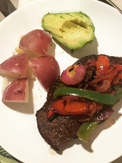 A picture of Steak and potatoes.