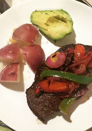 A picture of Steak and potatoes.