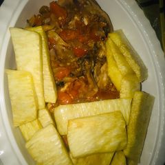 A picture of Yam with chicken sauce.