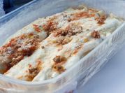 Una foto de canelones de carne y acelga
