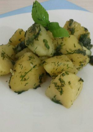 Una foto de Papas salteadas con cilantro