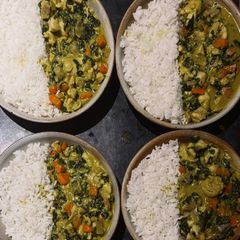 A picture of Coconut Fish Curry with Rice, Carrots & Spinach.