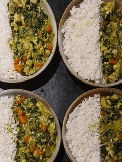 A picture of Coconut Fish Curry with Rice, Carrots & Spinach.