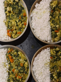 A picture of Coconut Fish Curry with Rice, Carrots & Spinach.