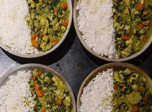 A picture of Coconut Fish Curry with Rice, Carrots & Spinach.
