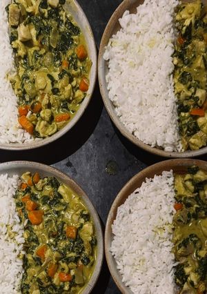 A picture of Coconut Fish Curry with Rice, Carrots & Spinach.