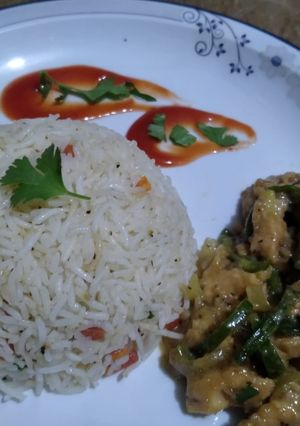 A picture of Dry chilli chicken with vegetables rice 😋.