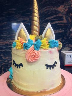 Una foto de Pastel arco iris unicornio