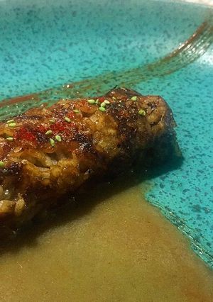 Una foto de Socarrat de arroz bomba en jugo de carne y pescado