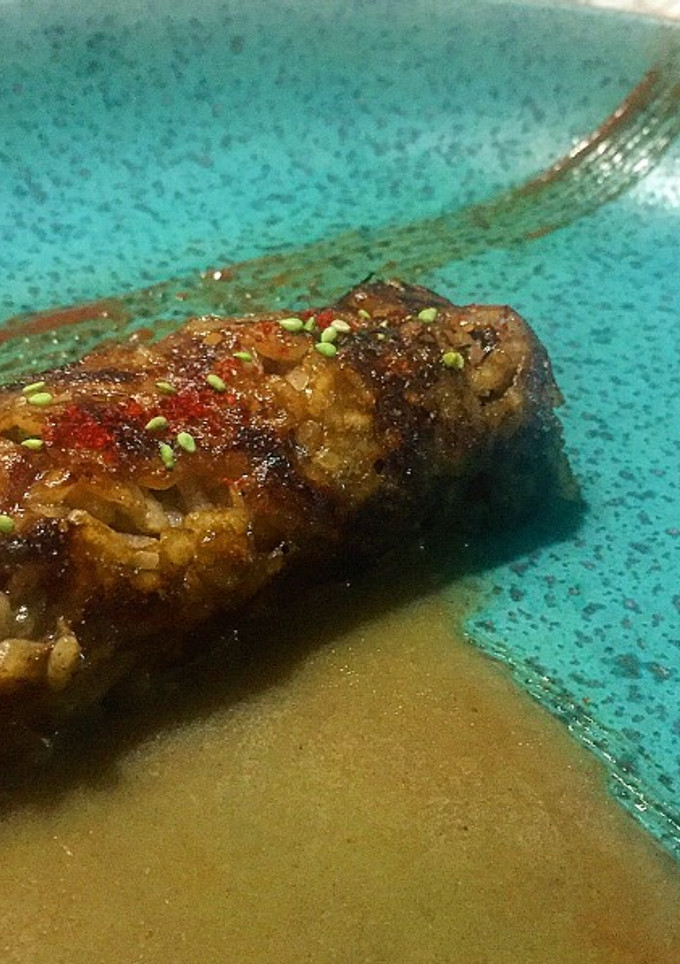 Una foto de Socarrat de arroz bomba en jugo de carne y pescado