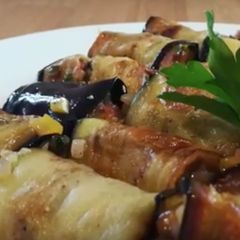 A picture of Aubergine and ratatouille rolls.