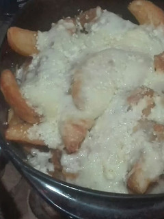 Una foto de Papas poutine