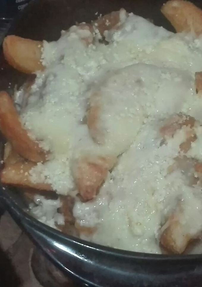 Una foto de Papas poutine