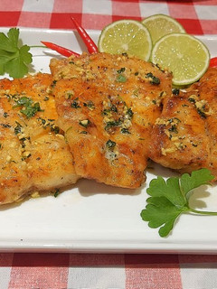 A picture of Pan seared fish with garlic herbed butter sauce.