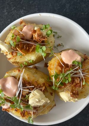 A picture of Cheddar Cheese Jack Potato, Crispy Onions & Salsa Rosa.