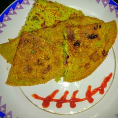 Stuffed green peas chilla A picture of Stuffed green peas chilla.