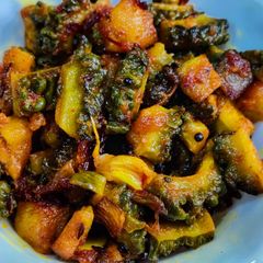 Karela aloo fry (bitter gourd potatoes fry) A picture of Karela aloo fry (bitter gourd potatoes fry).