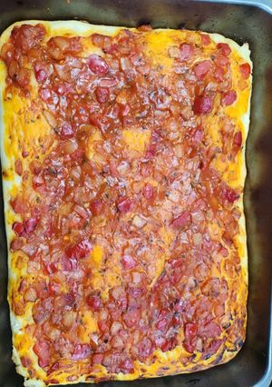 Una foto de Pizza esponjosa alta