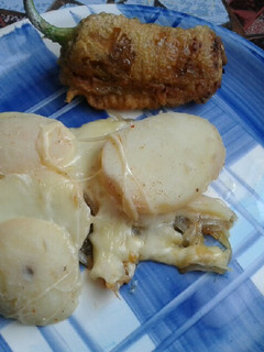 Una foto de Papas con queso