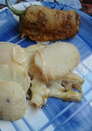 Una foto de Papas con queso