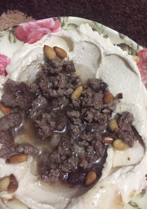 A picture of Hummus with Tahini and Lamb.