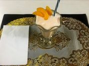 Una foto de duraznos en almibar licuado