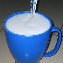 A picture of Creamy white rice, coconut and groundnut pap.