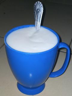 A picture of Creamy white rice, coconut and groundnut pap.