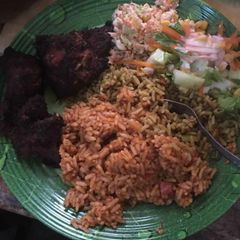 Jollof,coleslaw and grilled turkey A picture of Jollof,coleslaw and grilled turkey.