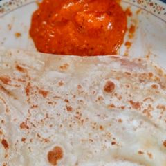 Garlic butter naan with red chilli chudney A picture of Garlic butter naan with red chilli chudney.