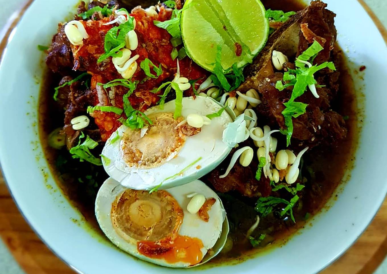 R A W O N (Brisket in Black Nut Sauce)