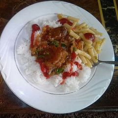 A picture of Plain boiled Rice, Beef Stew with chips.