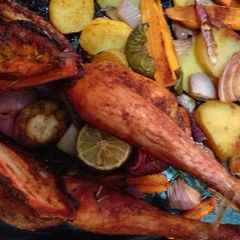 A picture of Roasted chicken with potatoes.