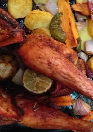 A picture of Roasted chicken with potatoes.