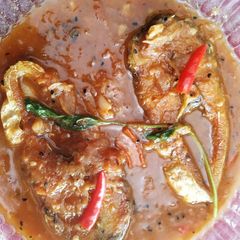Bhetki fish in burnt onion, garlic,and tomato A picture of Bhetki fish in burnt onion, garlic,and tomato.