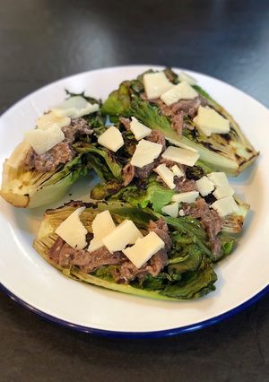 A picture of Charred baby gem with anchovy dressing 🔥🥬.