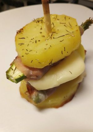 A picture of Asparagus, prosciutto and provolone potato stack.